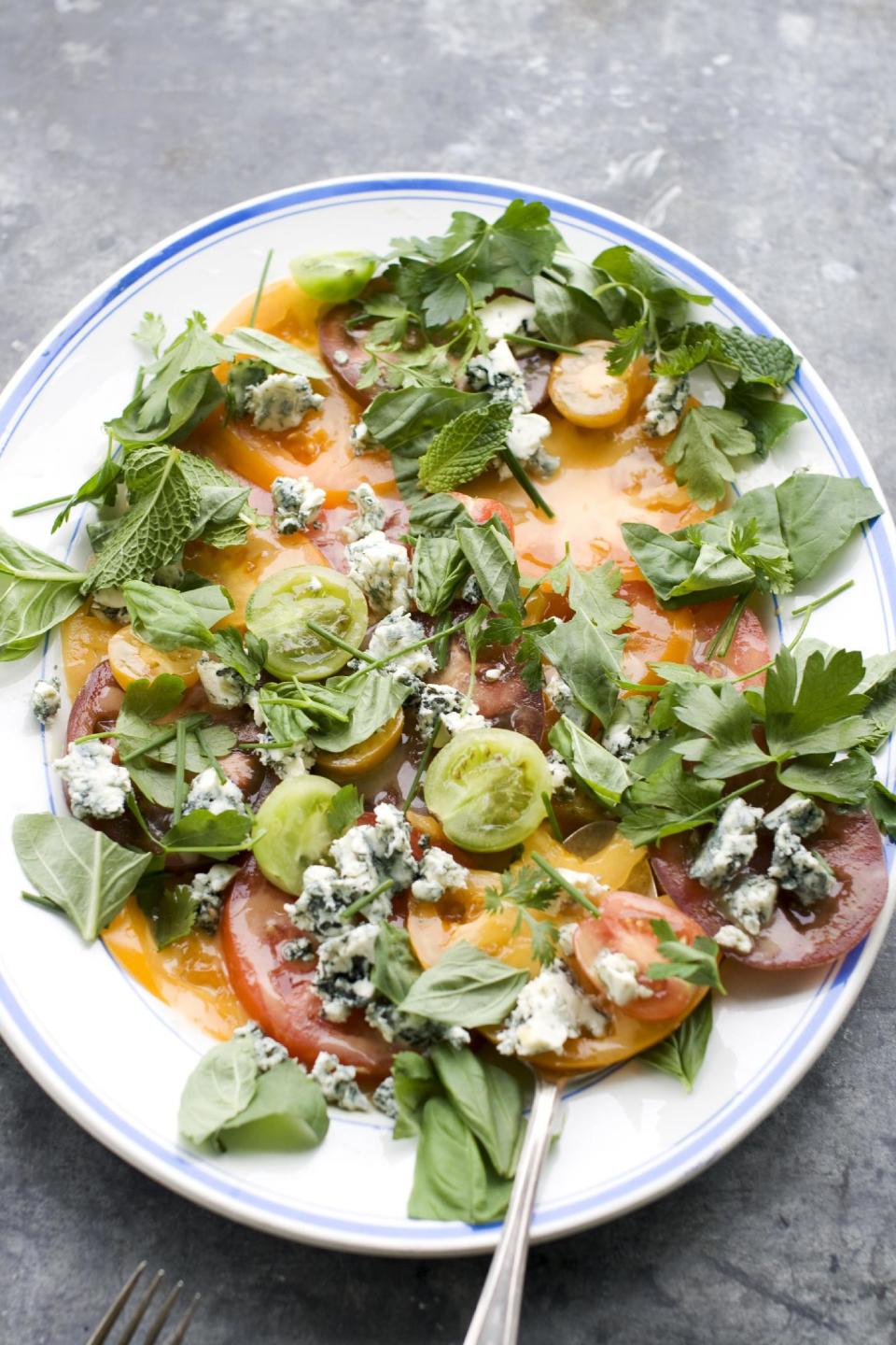 In this image taken on June 10, 2013, an American tomato salad is shown served on a platter in Concord, N.H. (AP Photo/Matthew Mead)