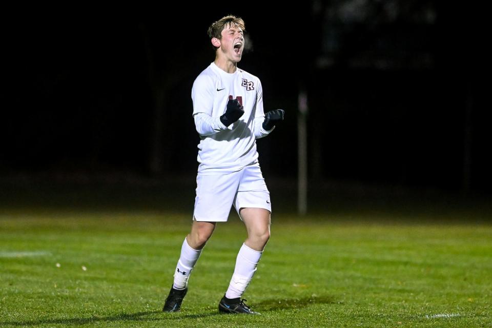 Eaton Rapids' Robert Noyes celebrates after a goal against Grosse Ile during PKs on Thursday, Oct. 27, 2022, at Williamston High School.