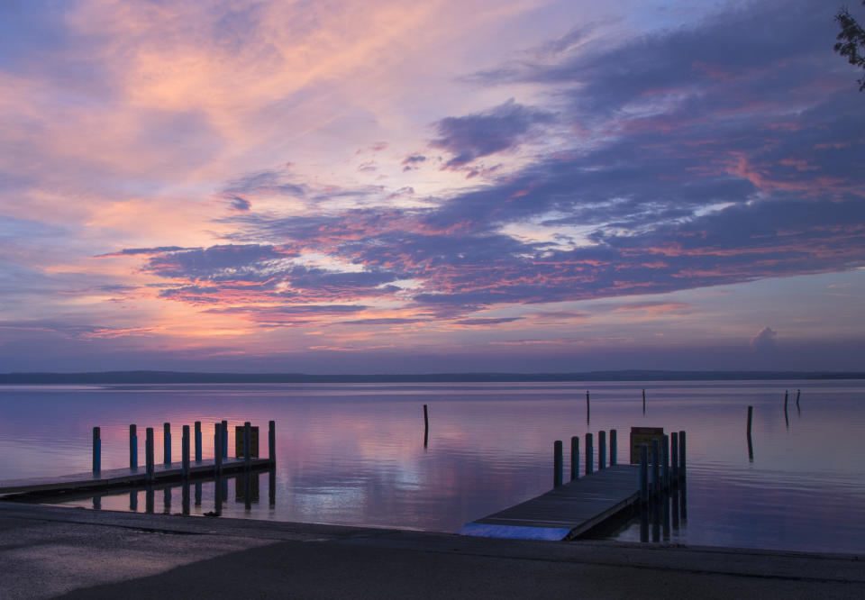 A few piers in Higgins Lake at dusk