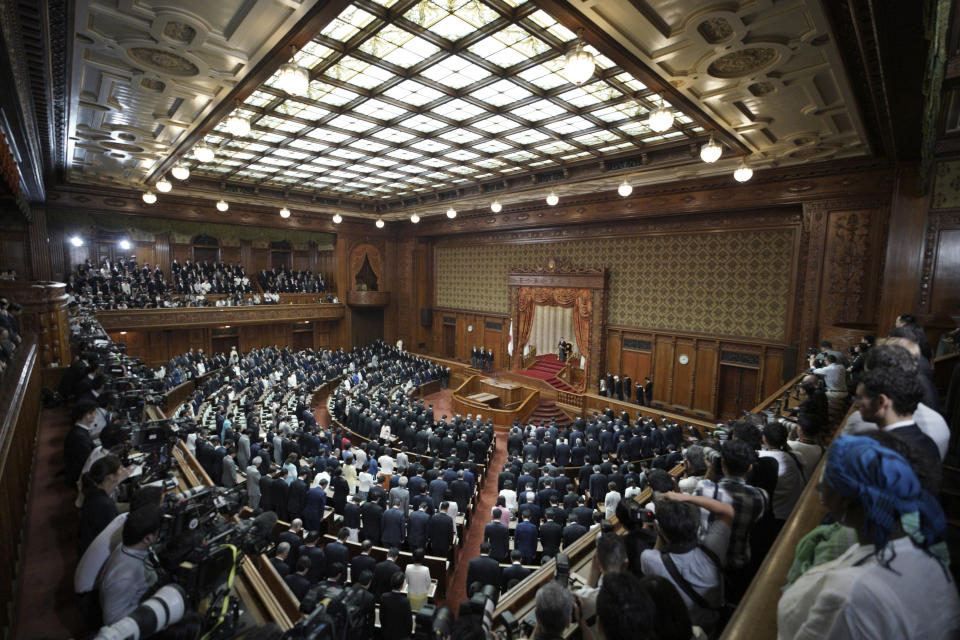 Japan's Emperor Naruhito reads a statement to open formally an extraordinary session at the upper house of parliament in Tokyo Thursday, Aug. 1, 2019. Naruhito delivered his first opening speech since ascending to the Chrysanthemum Throne on May 1. (AP Photo/Eugene Hoshiko)