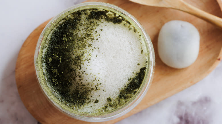 matcha latte with mochi and spoon