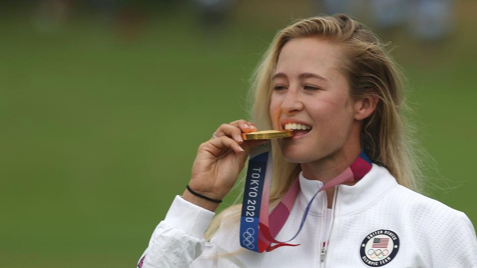 Nelly Korda kisses her Olympic gold medal at Tokyo 2020