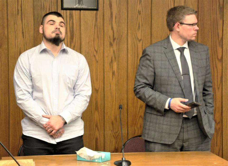 Teddy G. Thomas III, left, stares at the ceiling as Judge Matthew P. Frericks reads the verdict during Thomas' trial Thursday in Marion County Common Pleas Court. He was found guilty of five felony offenses. Also pictured is attorney David Johnson.