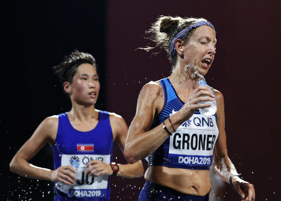 Roberta Groner, of the United States, pours water on herself during the women's marathon at the World Athletics Championships in Doha, Qatar, Saturday, Sept. 28, 2019. (AP Photo/Petr David Josek)