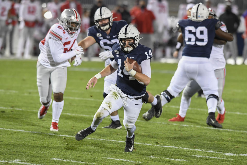 Penn State quarterback Sean Clifford (14) carries against Ohio State during the second quarter of an NCAA college football game in State College, Pa., Saturday, Oct. 31, 2020. (AP Photo/Barry Reeger)