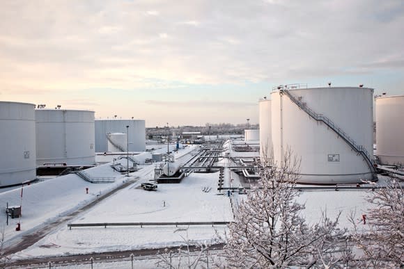 A petroleum storage tank farm with snow.