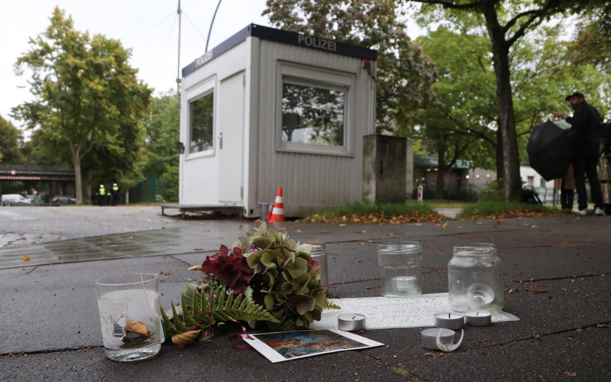 Candles and flowers in front of the synagogue of Eimsbuettel in Hamburg - FOCKE STRANGMANN/EPA-EFE/Shutterstock