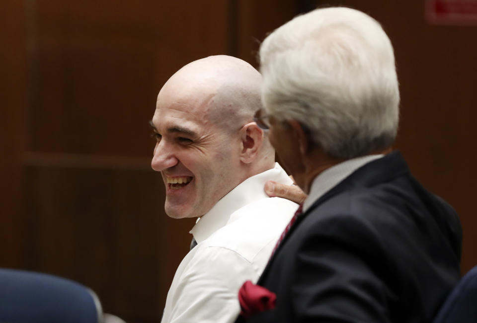 Michael Gargiulo, left, talks with his attorney Daniel Nardoni Tuesday, Aug. 6, 2019, in Los Angeles. Closing arguments started Tuesday in the trial of an air conditioning repairman charged with killing two Southern California women and attempting to kill a third. (Lucy Nicholson, Pool Photo via AP)