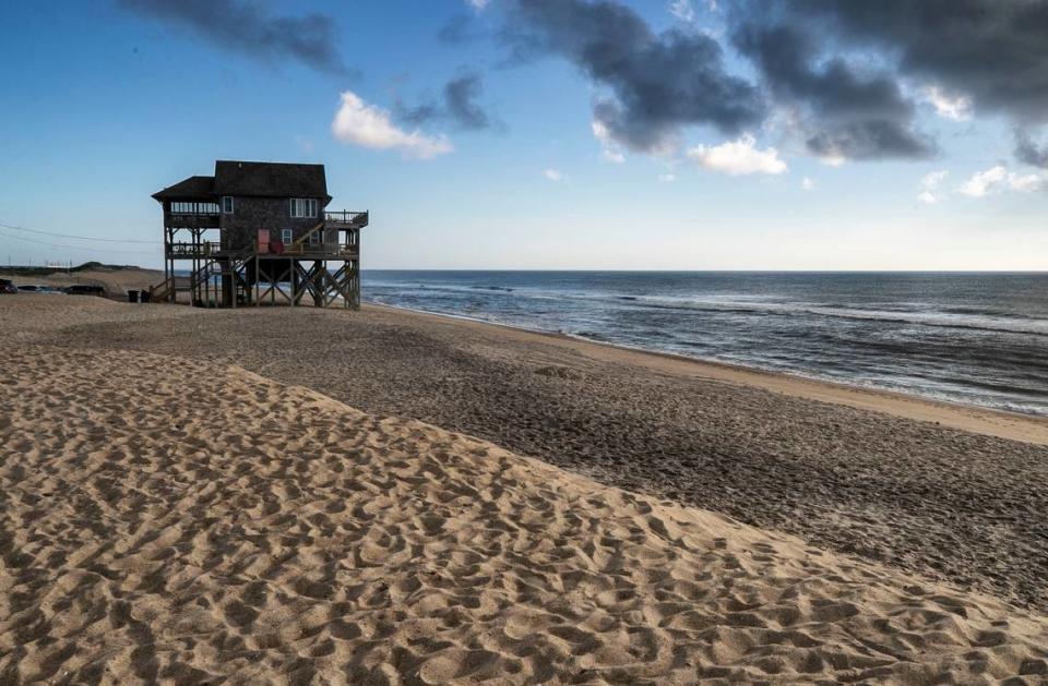 A beachfront home at the northern tip of Mirlo Beach in Rodanthe, N.C., photographed at sunrise on Wednesday, June 30, 2021. This is another of the hot spots along NC 12 that is often subjected to flooding and erosion during storms.