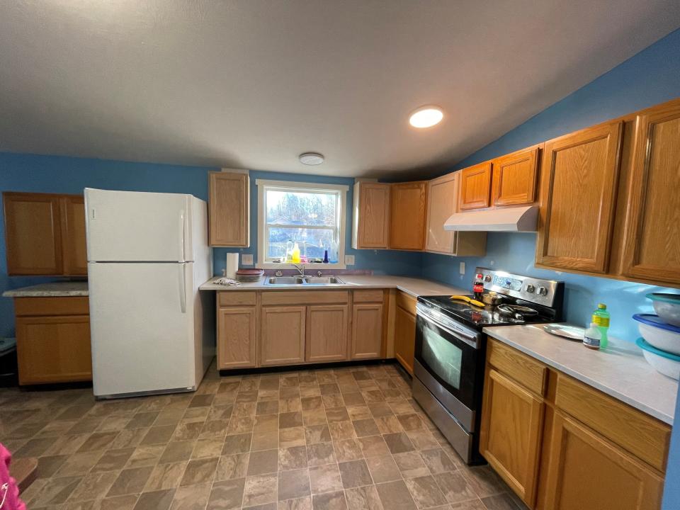 Today, Sylvia Wolfe's kitchen has new flooring, cabinetry, working appliances — and, at her request, walls painted blue.