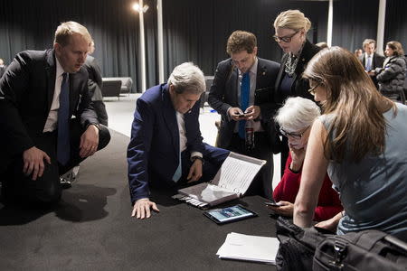 U.S. Secretary of State John Kerry (2nd L), U.S. Under Secretary for Political Affairs Wendy Sherman (2nd R) and staff watch a tablet in Lausanne as U.S. President Barack Obama makes a state address on the status of the Iran nuclear program talks, in this file photo taken on April 2, 2015. REUTERS/Brendan Smialowski/Pool