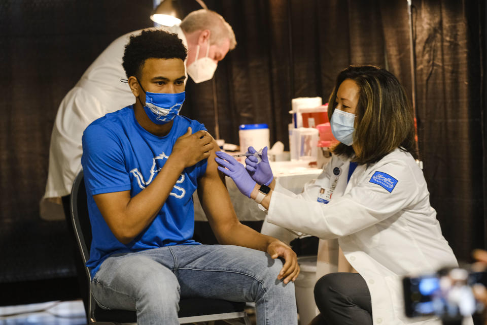 DETROIT, MI - APRIL 06: A group of teenagers serving as 'Covid-19 Student Ambassadors' joined Governor Gretchen Whitmer to receive a dose of the Pfizer Covid vaccine at Ford Field during an event to promote and encourage Michigan residents to go and get their vaccines on April 6, 2021 in Detroit, Michigan. As the US reaches a milestone in vaccinations, a surge of new Covid-19 cases has swept through the US with Michigan seeing the highest numbers of new cases. (Photo by Matthew Hatcher/Getty Images)