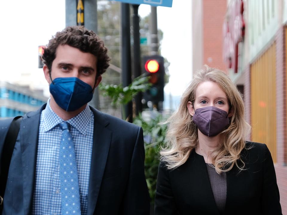 SAN JOSE, CA - DECEMBER 23: Billy Evans walks with his partner Theranos founder and former CEO Elizabeth Holmes and her mother Noel Holmes as they leave the Robert F. Peckham Federal Building on December 23, 2021 in San Jose, California. Jury deliberations continue in the Elizabeth Holmes fraud trial as she faces charges of conspiracy and wire fraud for allegedly engaging in a multimillion-dollar scheme to defraud investors with the Theranos blood-testing lab services.