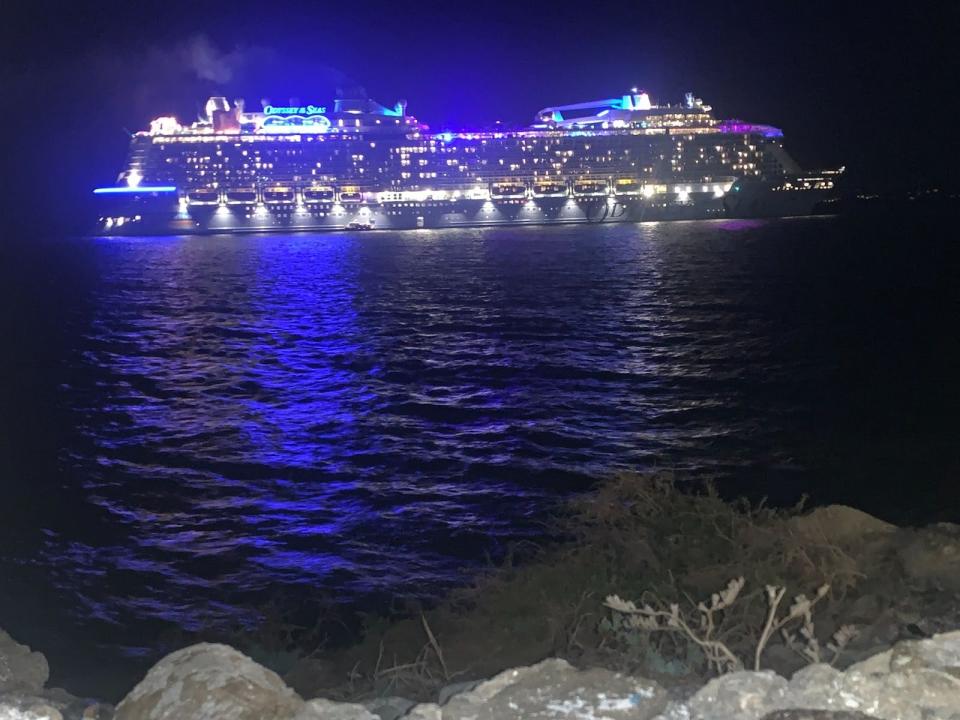 cruise ship lit up at night