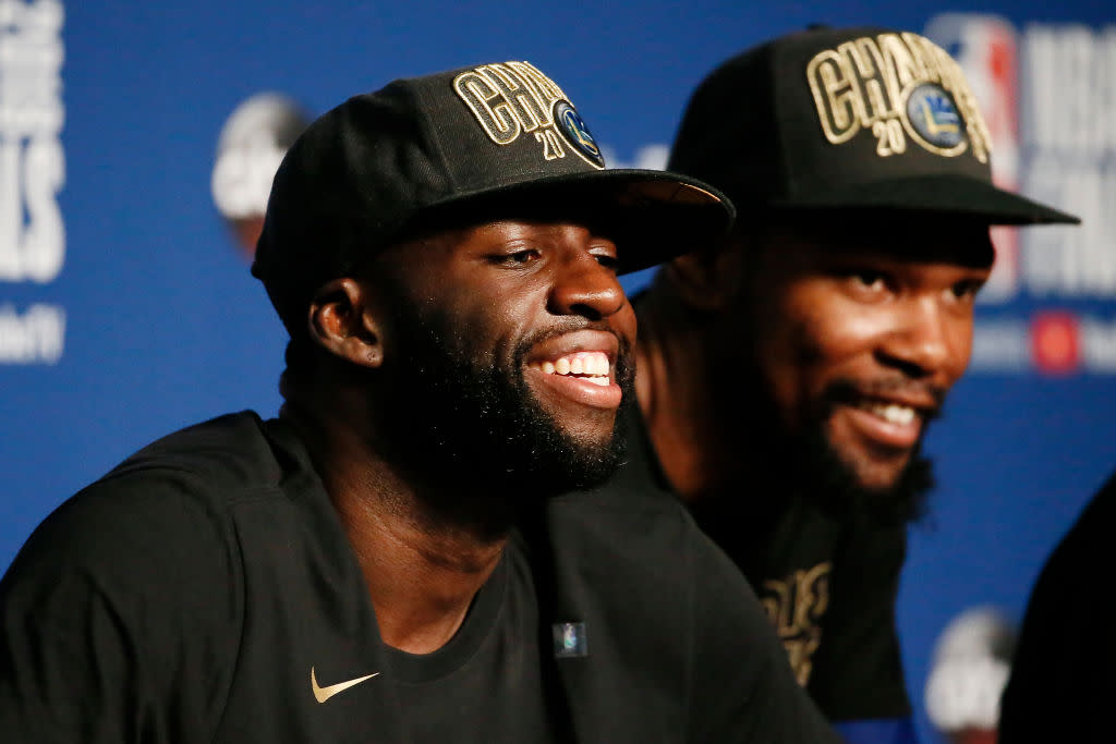 Draymond Green smiles like a man who’s got his outfit for Tuesday all picked out. (Getty)