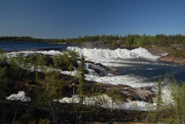 The South Valley spillway on the Taltson River. Two of three 'small gates' at the Nonacho Lake Dam have been opened to keep Nonacho Lake within the parameters of its water licence for the Taltson Hydro facility, the Northwest Territories Power Corporation said in a news release on Friday.  (N.W.T. Power Corporation  - image credit)