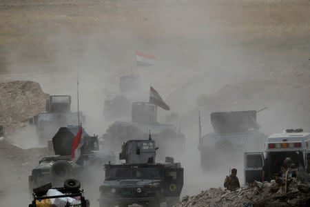 Vehicles of the Iraqi security forces move toward Falluja on the outskirts of the city in Iraq, June 10, 2016. REUTERS/Alaa Al-Marjani/File Photo