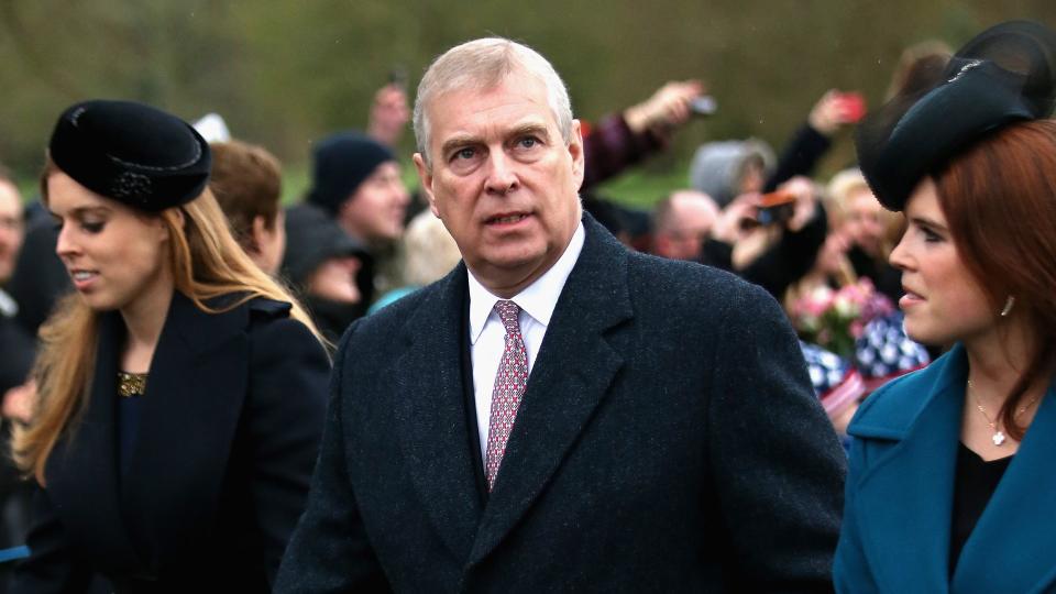 Prince Andrew walking with Princess Beatrice and Princess Eugenie