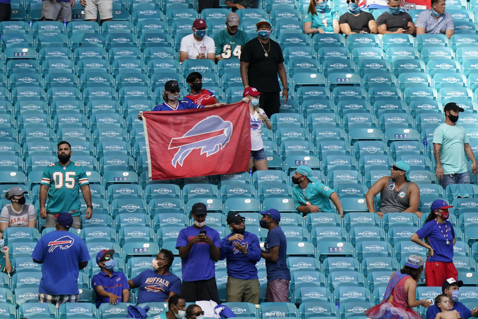 Buffalo Bills fans celebrate their team during the second half of an NFL football game against the Miami Dolphins, Sunday, Sept. 20, 2020 in Miami Gardens, Fla. The Bills defeated the Dolphins 31-28. (AP Photo/Wilfredo Lee)