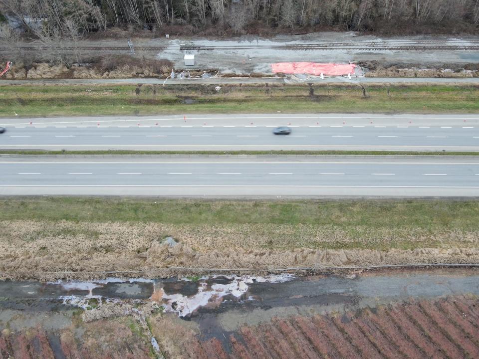 The crash site sits on the north side of Highway 91, while the blueberry farm is on the other side. Easton says contaminants have flowed across through a culvert.