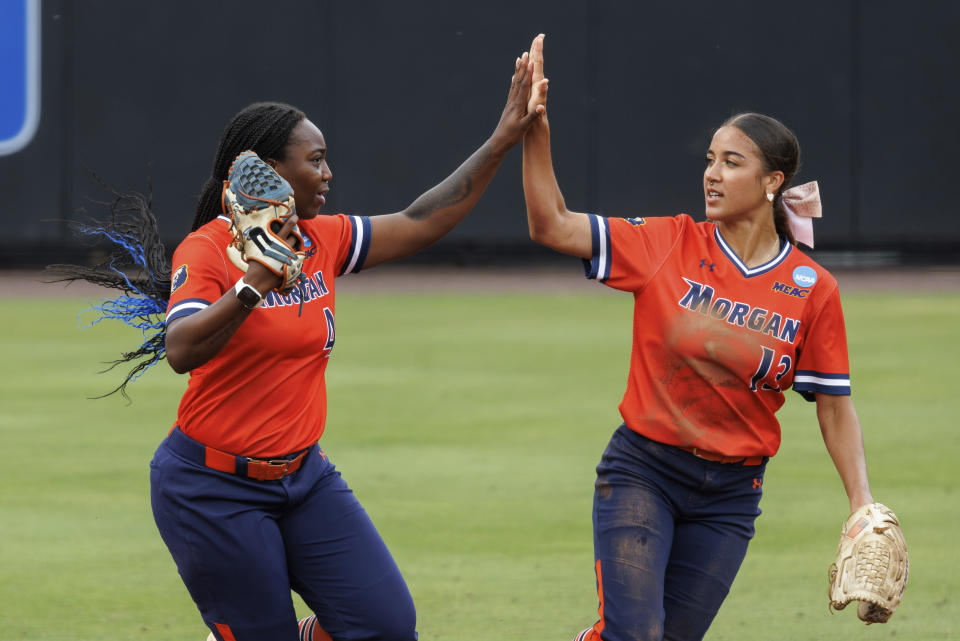 Morgan State's Anaya Hunte, left, celebrates with Mia Ewell (13) after making a catch during an NCAA college softball game against Duke, Friday, May 17, 2024, in Durham, N.C. (AP Photo/Ben McKeown)