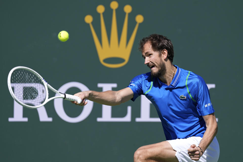 Daniil Medvedev, of Russia, returns a shot against Frances Tiafoe, of the United States, during a semifinal match at the BNP Paribas Open tennis tournament Saturday, March 18, 2023, in Indian Wells, Calif. (AP Photo/Mark J. Terrill)