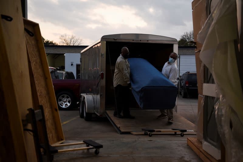 The Wider Image: 'I just ask God to help me': Texas funeral home crushed by death as U.S. COVID toll nears 500,000