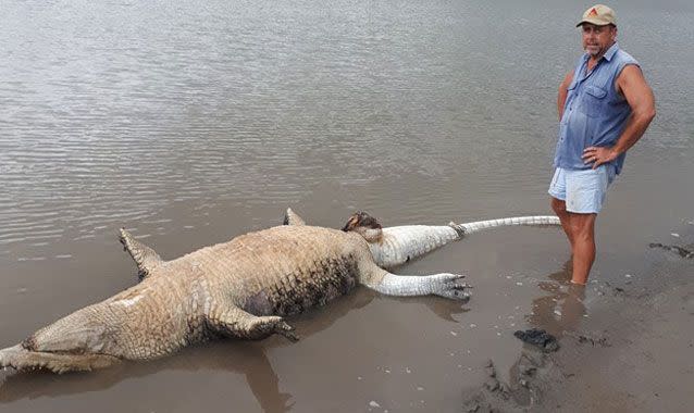 Mark Norman with the dead 4.1 metre croc he found. Source: Mark Norman