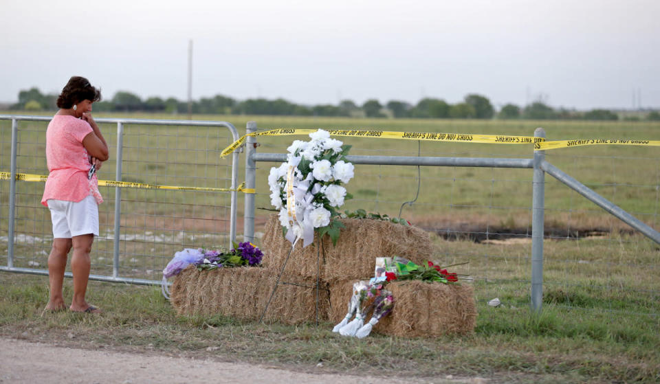 <p>Hot Air Balloon Crash Texas</p><p>Kathy Stephens, of Kyle, Texas, pauses at a memorial, Monday Aug. 1, 2016, at the site of a hot air balloon crash that killed 16 people on Saturday near Lockhart, Texas. (Edward A. Ornelas/San Antonio Express-News via AP)</p>