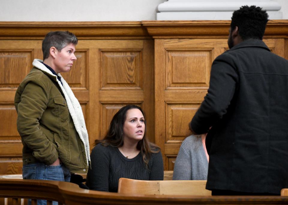 Former Stark County Sheriff Detective Amber Davis and Katie Marskell talk after the sentencing of Lindsey Abbuhl on felony endangering children and felony theft in the Stark County Courthouse before Judge Chryssa Hartnett.