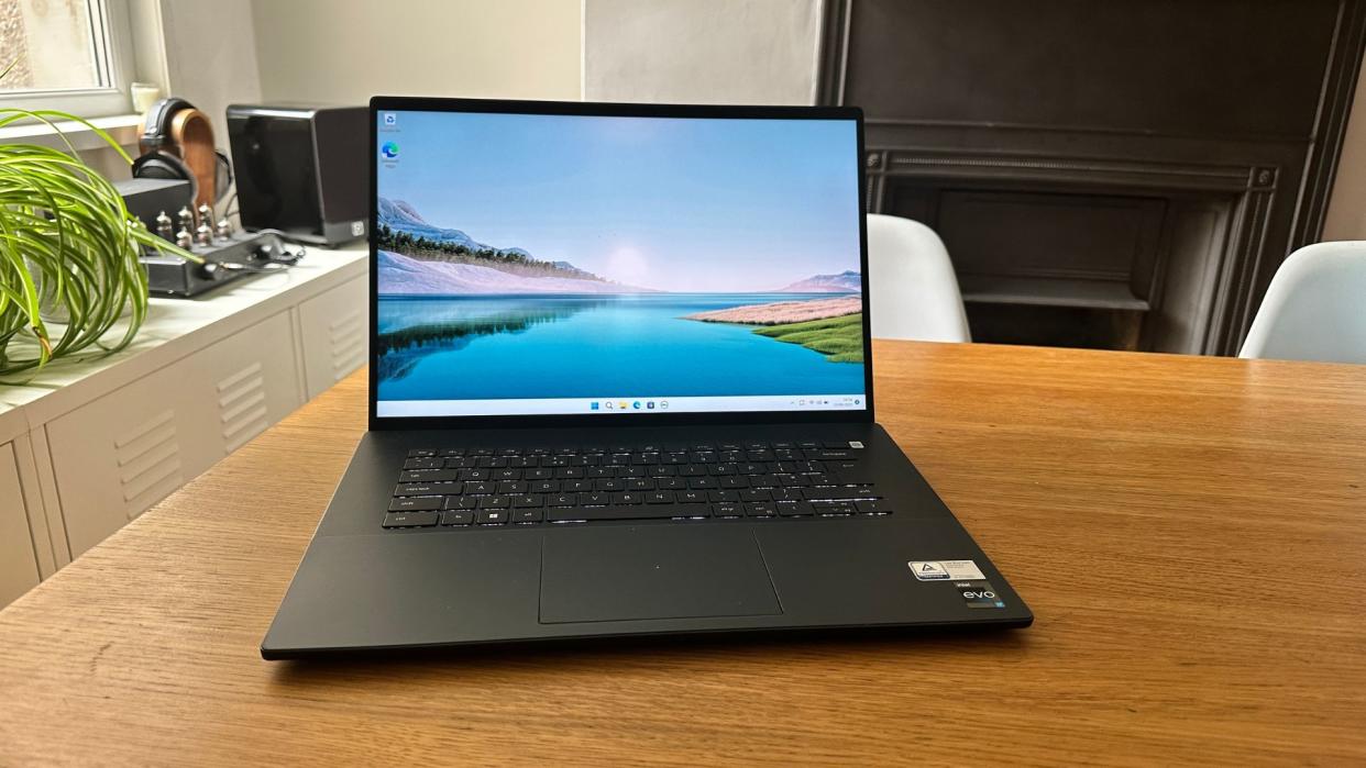  An open Dell Inspiron 16 Plus 7620 sitting on a wooden table 