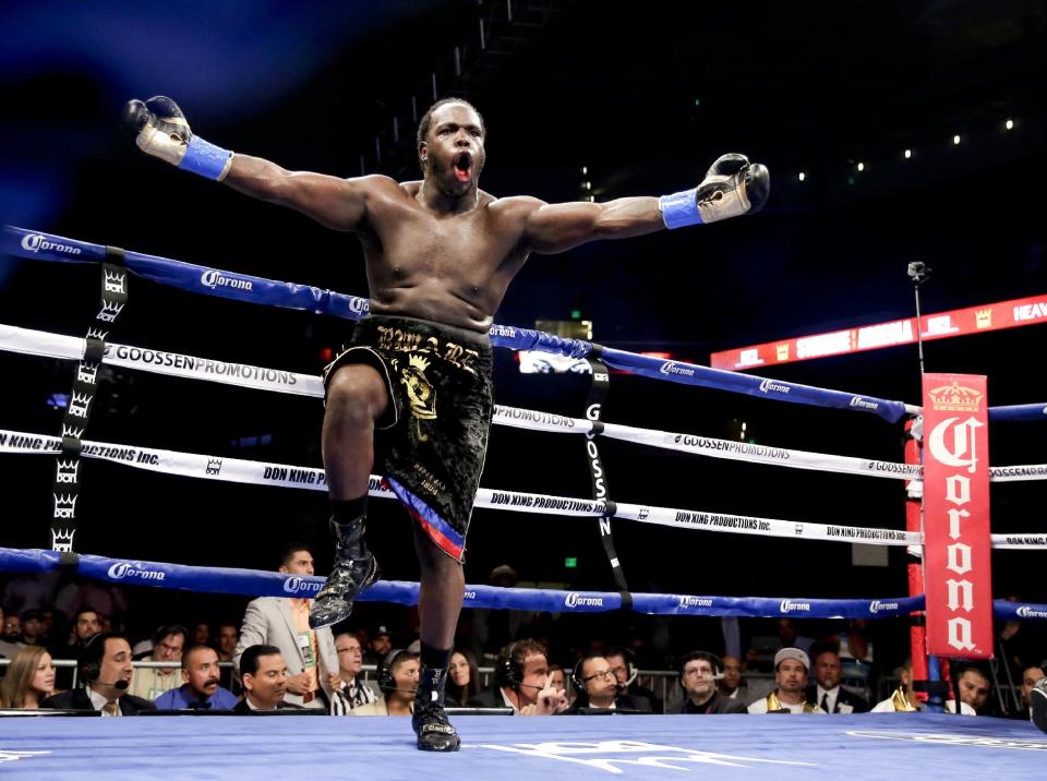 Bermane Stiverne celebrates after referee Jack Reiss stopped his fight against Chris Arreola during their rematch for the WBC heavyweight boxing title in Los Angeles, Saturday, May 10, 2014. Stiverne won the title. (AP Photo/Chris Carlson)
