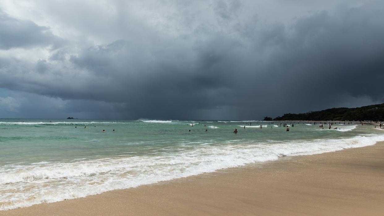  Beach with storm clouds. 