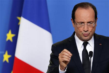 France's President Francois Hollande speaks at a news conference at the end of the first session of a two-day European Union (EU) leaders summit in Brussels October 19, 2012. REUTERS/Christian Hartmann