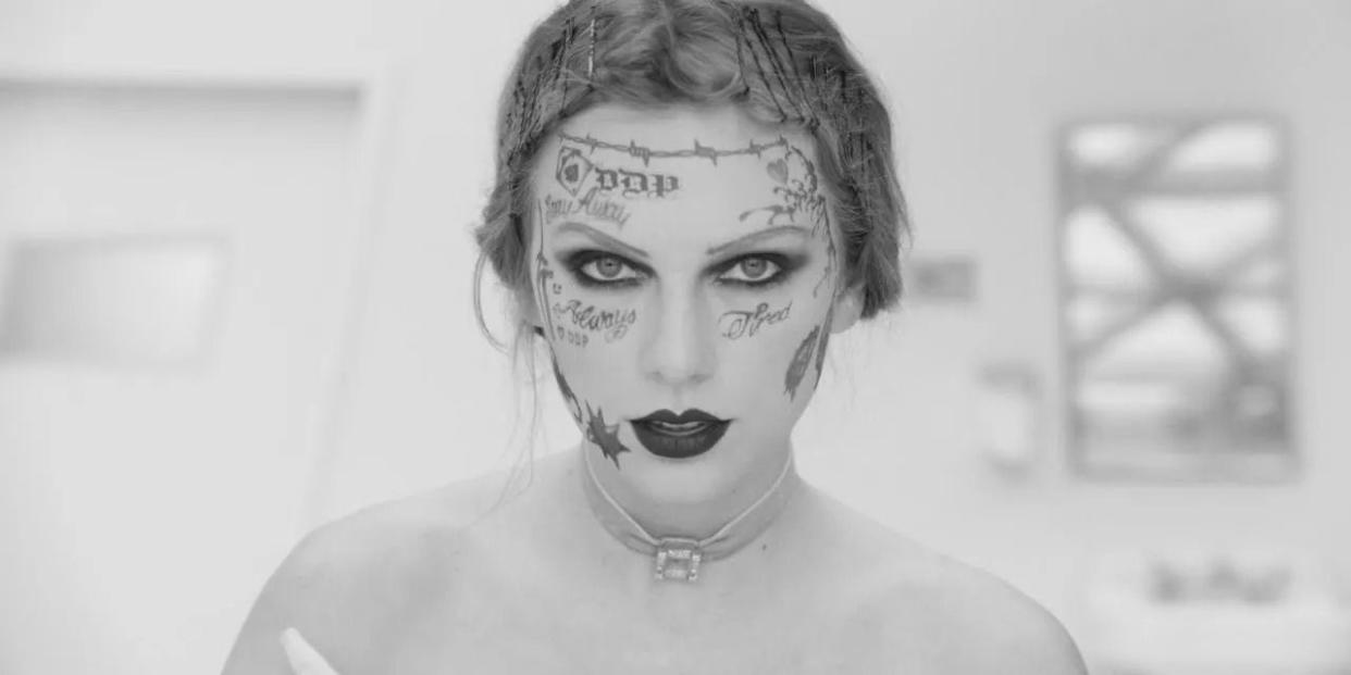 taylor swift fortnight music video in black and white featuring fake tattoos on her face