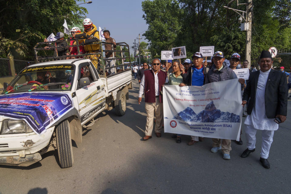 People from the mountaineering community, Sherpa guides and officials participate in a rally to mark the 70 anniversary of the first ascent of Mount Everest in Kathmandu, Nepal, Monday, May 29, 2023. The 8,849-meter (29,032-foot) mountain peak was first scaled by New Zealander Edmund Hillary and his Sherpa guide Tenzing Norgay on May 29, 1953. (AP Photo/Niranjan Shrestha)