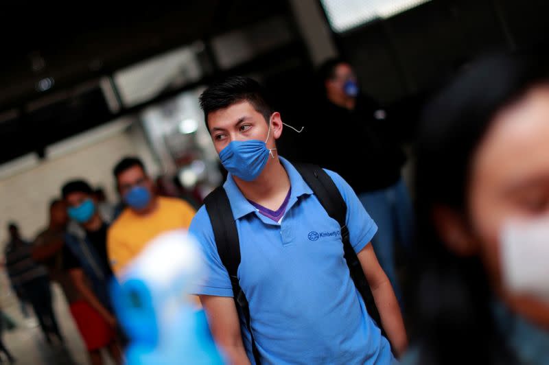 A commuter is seen before a temperature check inside a metro, as the government plans to start easing restrictions amid the outbreak of the coronavirus disease (COVID-19) in Mexico City