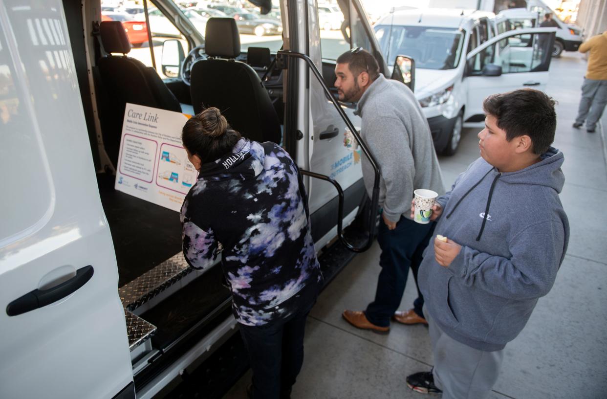 People check out a mobile van to be used in Stockton's first-of-its-kind mobile crisis intervention response pilot program which was introduced at a news conference at the Stockton Ballpark in downtown Stockton on Thursday, Nov. 3, 2022. The program, a joint venture between CMC and the City of Stockton, will deal behavioral health calls that are currently handled by the police.