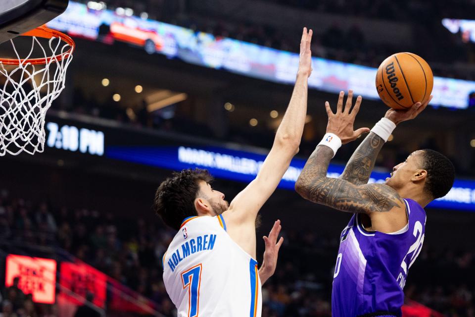 Utah Jazz forward John Collins (20) shoots the ball with Oklahoma City Thunder forward Chet Holmgren (7) on defense during an NBA basketball game between the Utah Jazz and the Oklahoma City Thunder at the Delta Center in Salt Lake City on Tuesday, Feb. 6, 2024. | Megan Nielsen, Deseret News