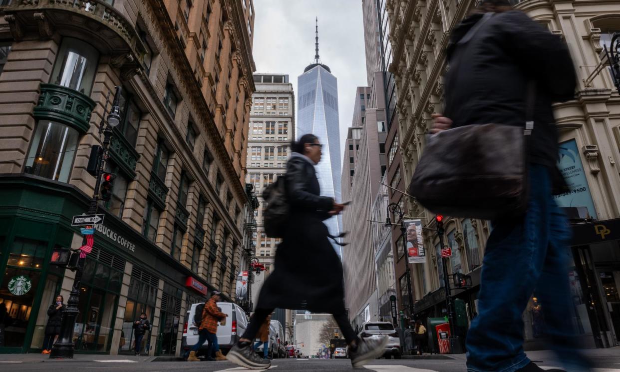 <span>People walk through lower Manhattan moments after New York City and parts of New Jersey experienced a 4.8-magnitude earthquake on 5 April 2024.</span><span>Photograph: Spencer Platt/Getty Images</span>