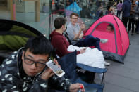 Buyers of new Apple products including the iPhone 7 to be released on September 16 camp outside the company's flagship Australian store in Sydney, September 15, 2016. REUTERS/Jason Reed