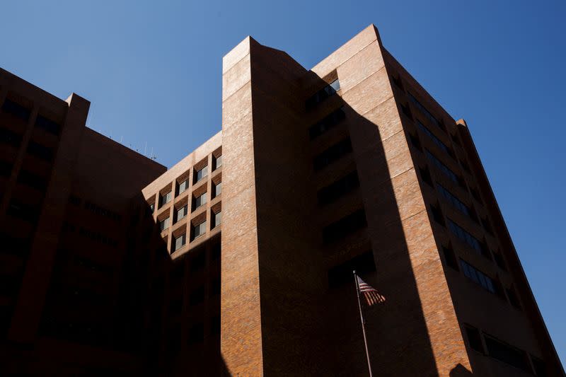 FILE PHOTO: U.S. flag flies outside Lincoln Medical Center where a cooling tower has been tested and disinfected following a deadly outbreak of Legionnaires' disease in the South Bronx region, New York