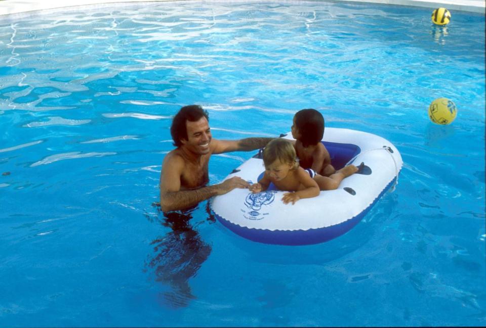 <p>Julio Iglesias, with sons Enrique and Julio Jr., in Costa del Sol, Spain in 1978.</p>