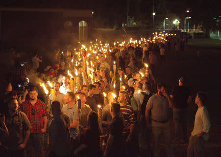 White nationalists carry torches on the grounds of the University of Virginia, on the eve of a planned Unite The Right rally in Charlottesville, Virginia, U.S. August 11, 2017. Alejandro Alvarez/News2Share via REUTERS