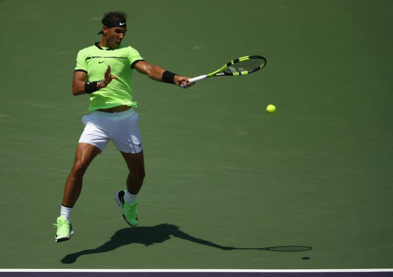 Rafael Nadal of Spain returns a shot during his 6-1, 7-5 win over Italian Fabio Fognini at the Miami Open