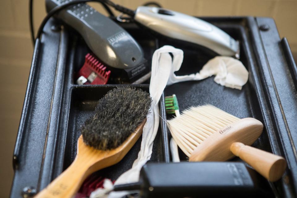 Clippers and brushes sit on a shelf at the makeshift barbershop at Warner Elementary. 