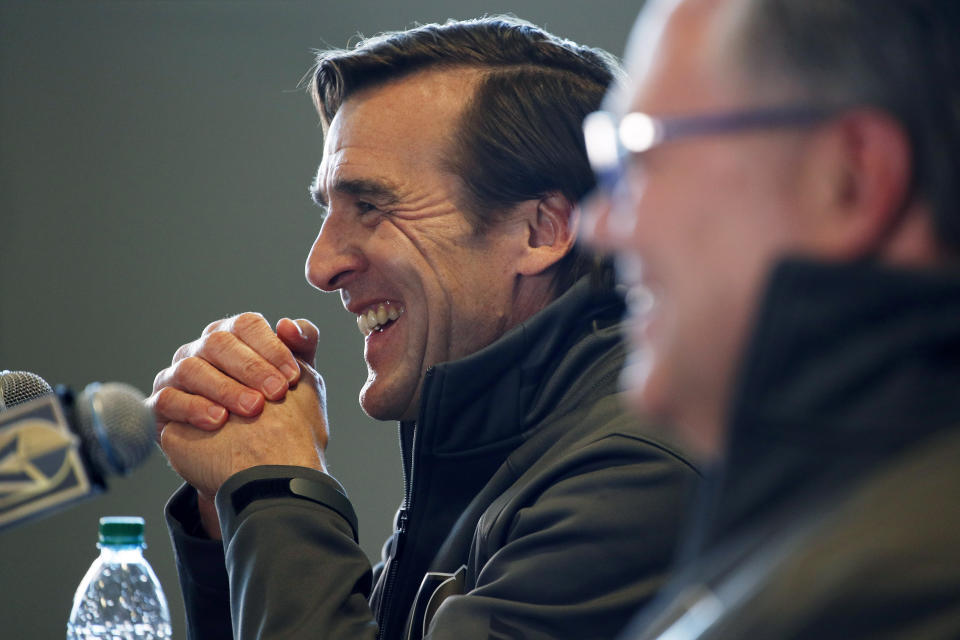 FILE - In this Thursday, May 2, 2019 file photo, George McPhee, left, president of hockey operations with the Las Vegas Golden Knights, speaks at a news conference with new general manager Kelly McCrimmon, right, Thursday, May 2, 2019, in Las Vegas. Four years since George McPhee was a “puppet master” of the NHL leading up to the Vegas expansion draft, general managers approached this trade deadline with Seattle’s upcoming addition to the league in mind. While Kraken GM Ron Francis prepares – and maybe made a handshake deal or two already like McPhee did – Seattle was on his colleagues’ minds. (AP Photo/John Locher, File)