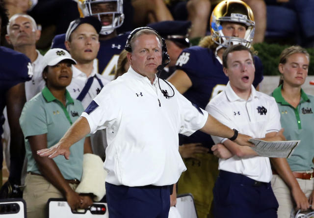 Notre Dame head coach Brian Kelly signals from the sideline during a game this season. (AP)