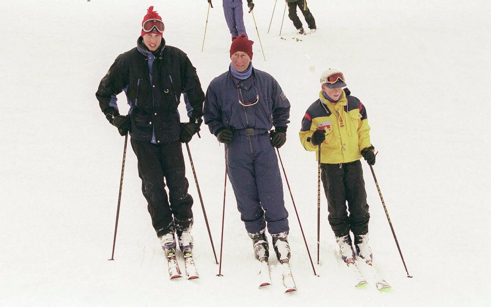 The King with Princes William and Harry on their skiing holiday to Canada in 1997