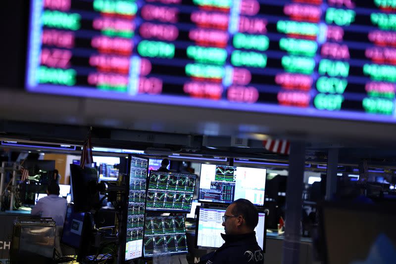 Traders work on the trading floor at the New York Stock Exchange (NYSE) in New York City